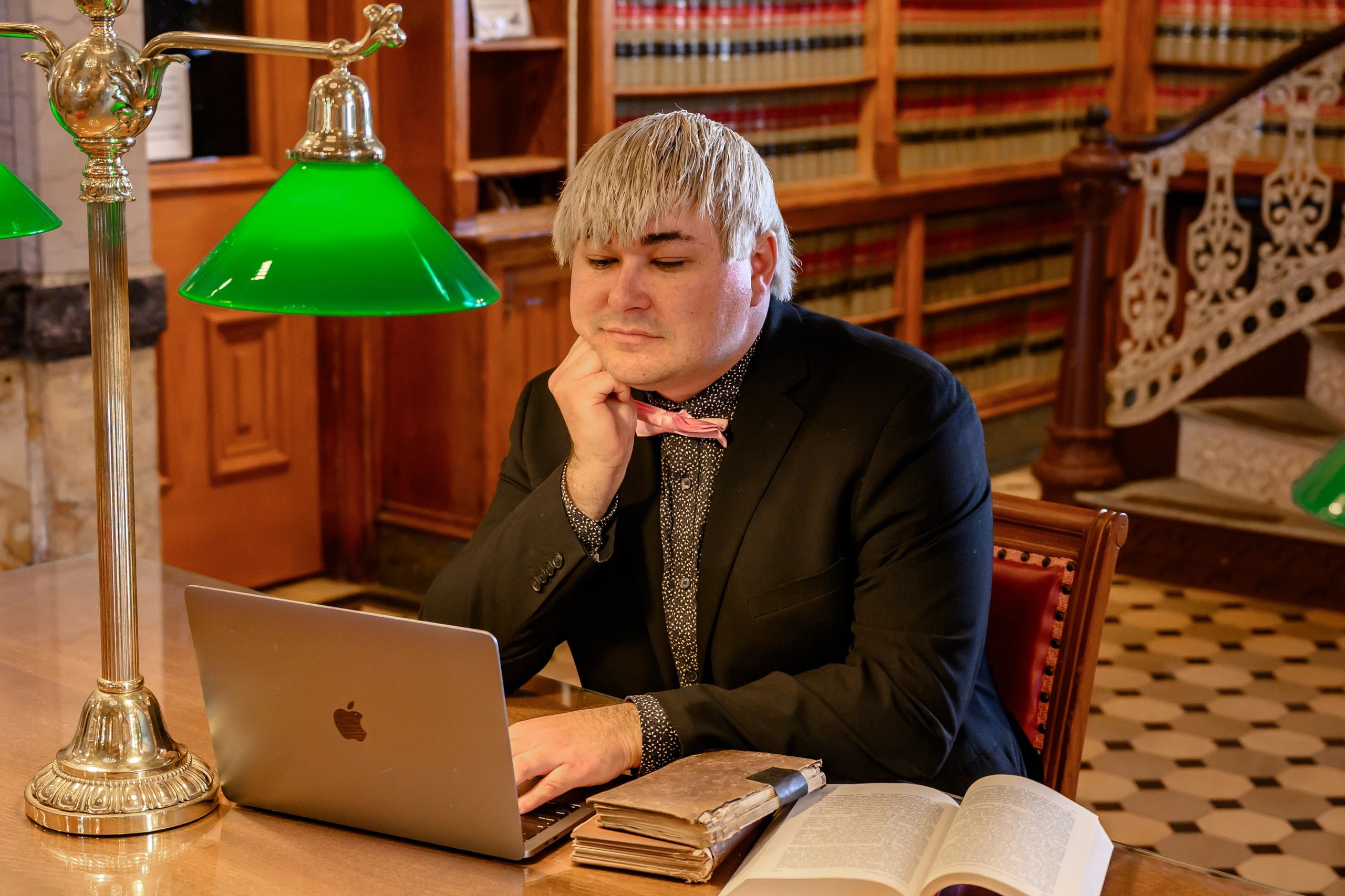 Matthew Tate, Enrolled Agent, working at a law library table in Springfield, Missouri